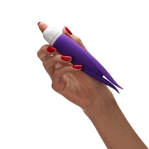 На фото зображено фіолетовий вібратор із пелюстками Fun Factory VOLITA для жінок на білому тлі.