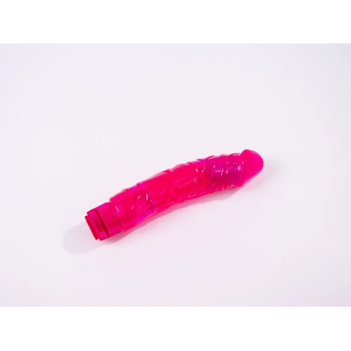 На фото изображен розовый фаллоимитатор-вибратор Dorcel Jelly Boy унисекс на белом фоне.