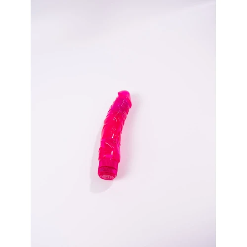 На фото изображен розовый фаллоимитатор-вибратор Dorcel Jelly Boy унисекс на белом фоне.