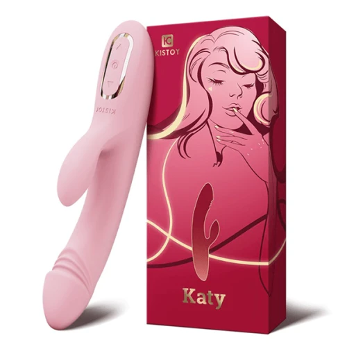 оскорбление демонстрирует розовый вибратор-кролик KisToy Katy с подогревом, представленный в розовой коробке.оскорбление демонстрирует розовый вибратор-кролик KisToy Katy с подогревом, представленный в розовой коробке.
