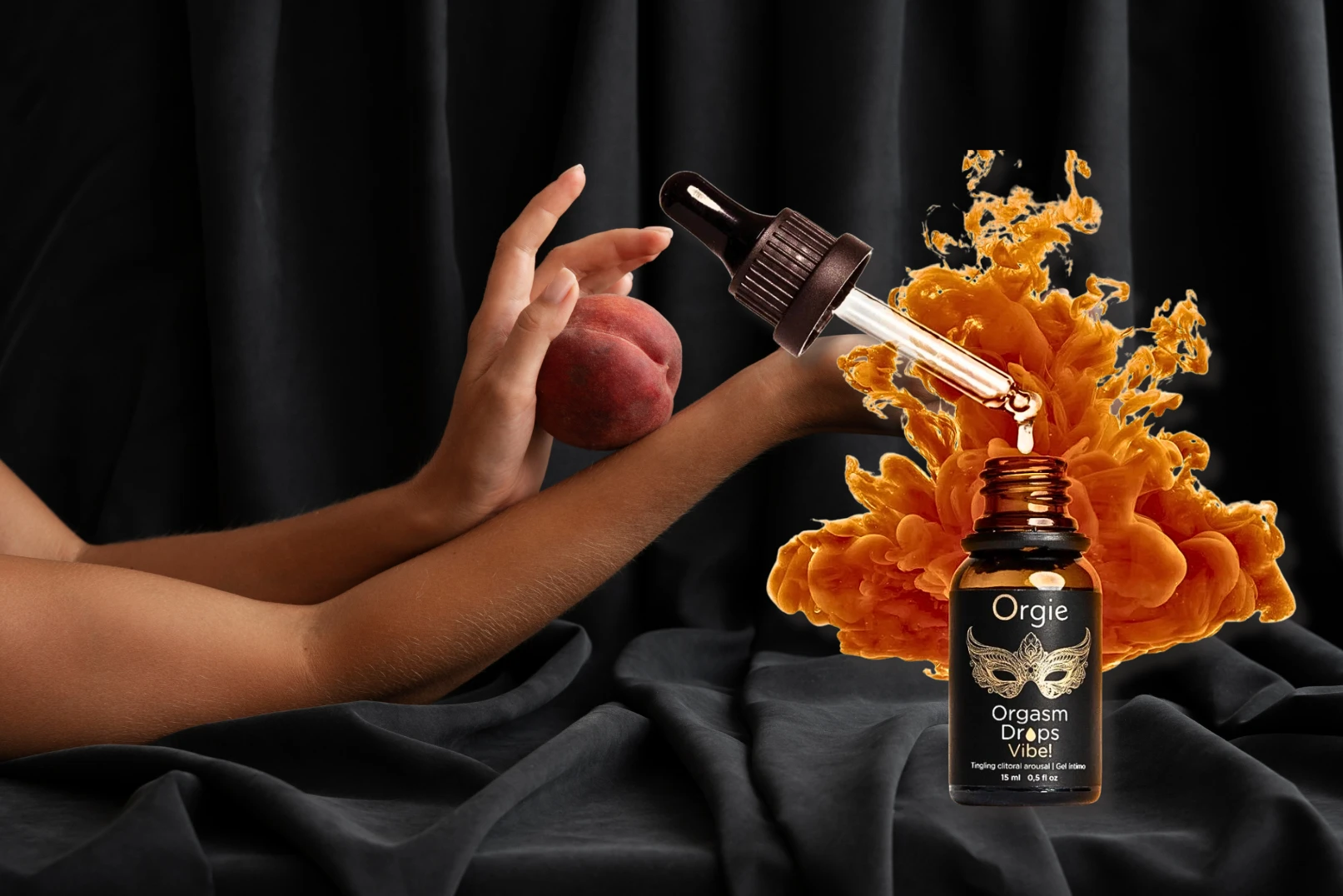 на фото зображено збуджувальні краплі для клітора Orgie Orgasm на чорному фоны