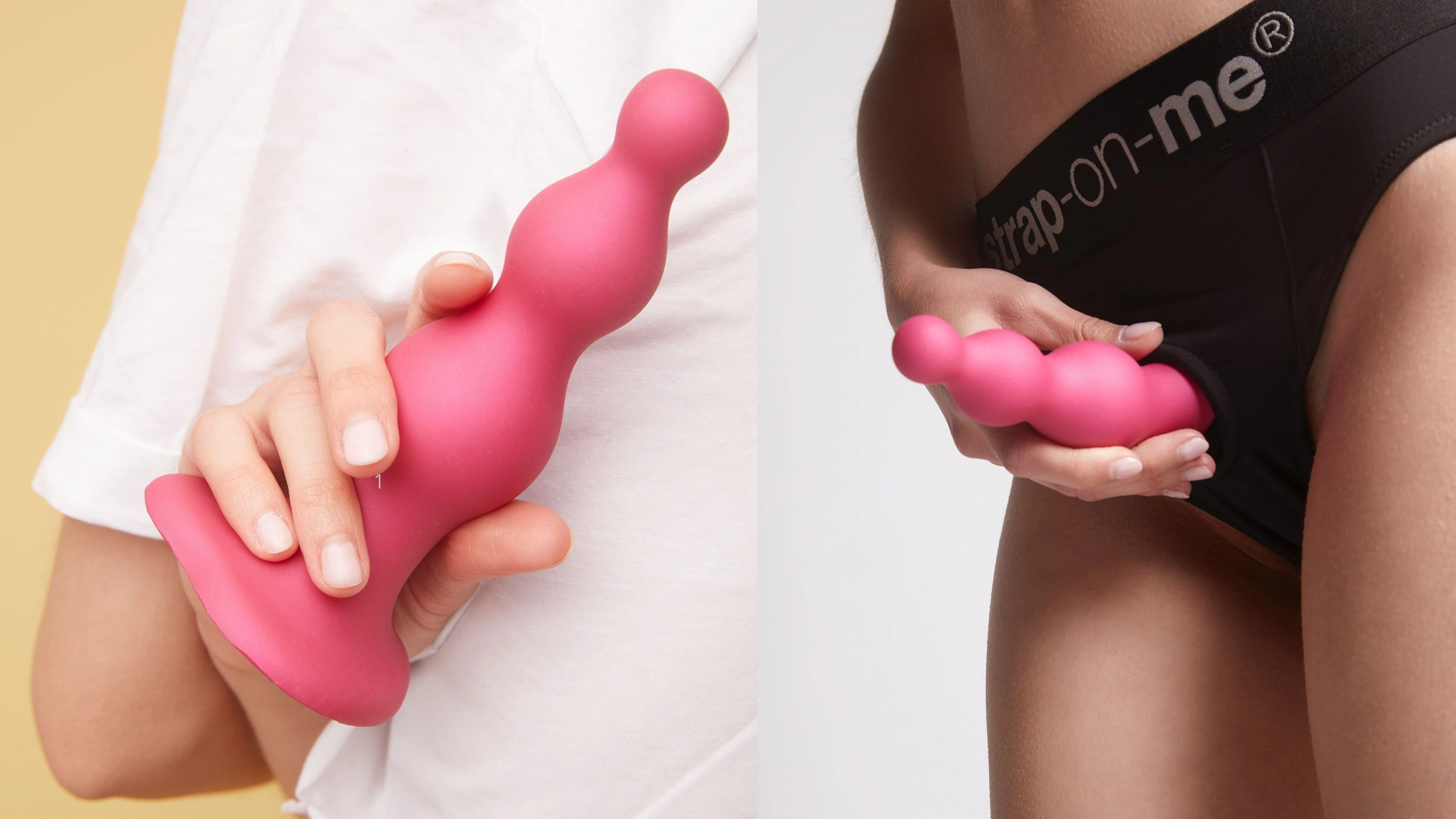 на фото зображений рожевий силіконовий страпон в жіночих руках