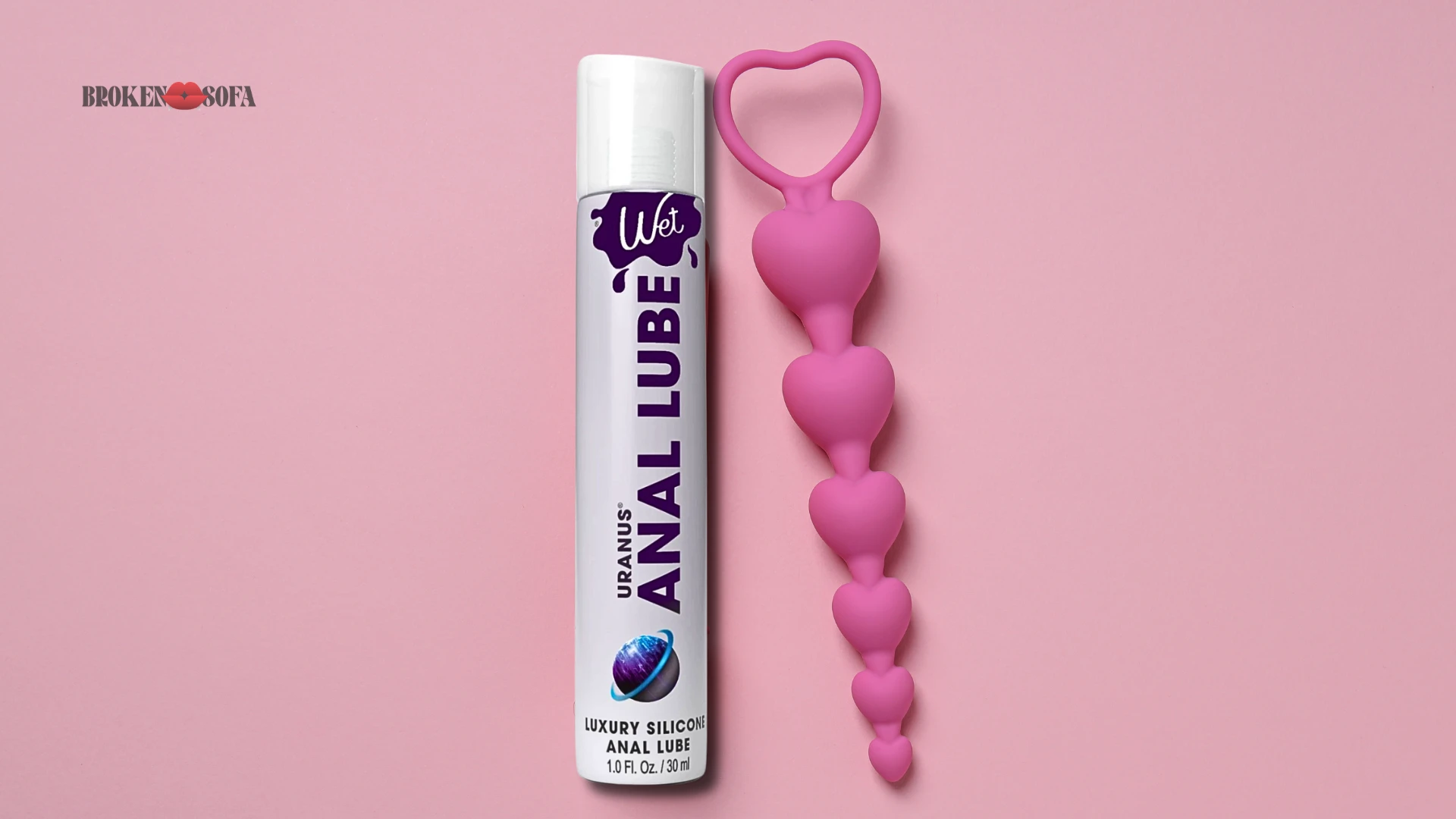 Купить лубриканты интимные для секса на розовом фоне изображен лубрикант для анального секса и анальные бусы