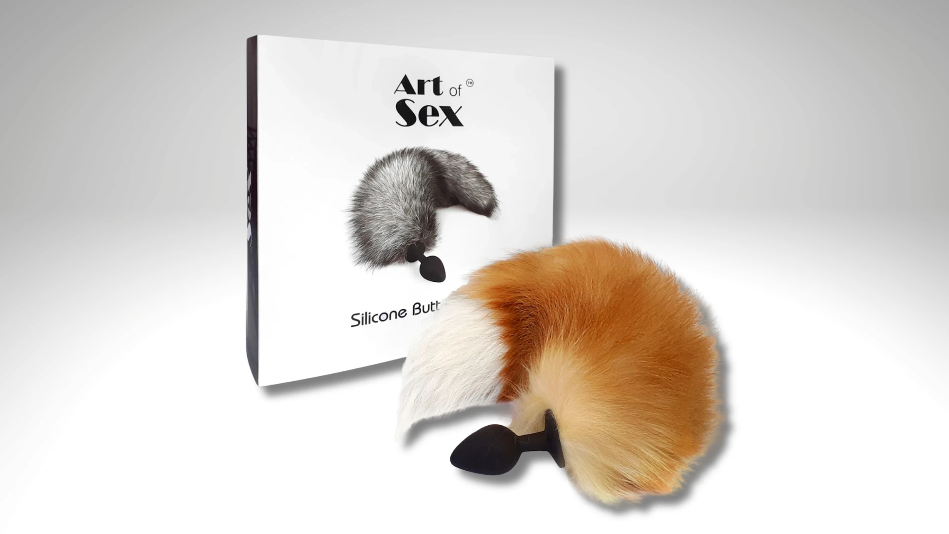 на фото изображена силиконовая анальная пробка с рыжим лисьим хвостом бренда Art of sex