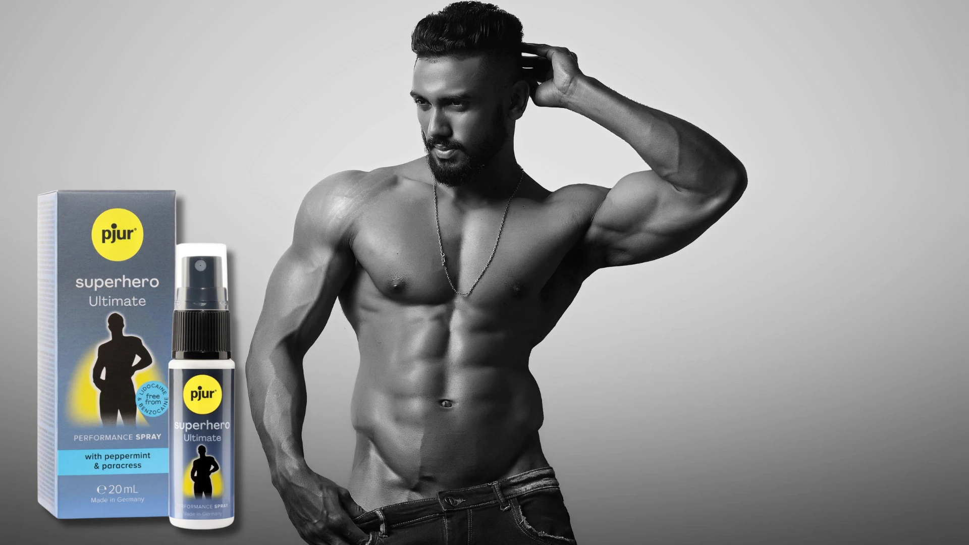на фото зображений збуджуючий спрей для чоловіків Pjur Superhero spray та сексуальний чоловік з оголений торсом чорно-білий фон