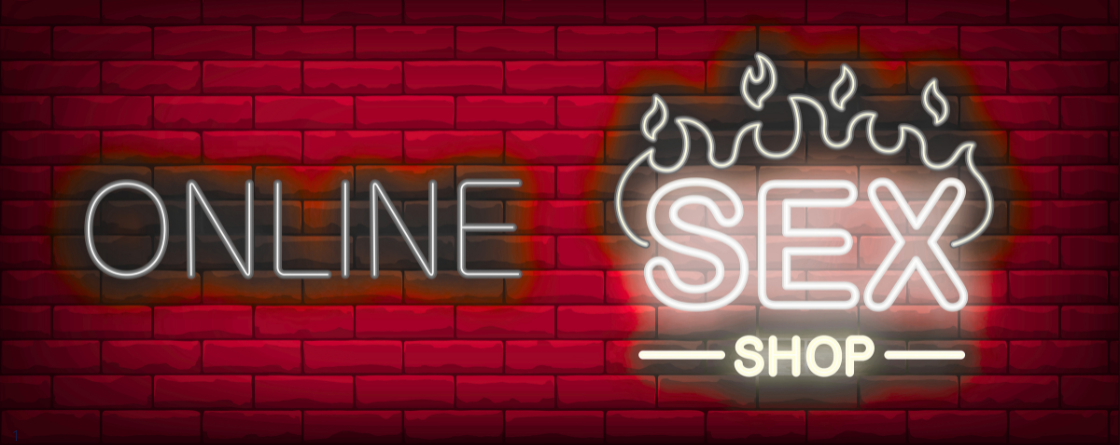 sex shop online надпись неоновая светящаяся на фоне красных кирпичей
